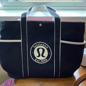 Lululemon Black Tote Bag with White Trim size is 20x 13.